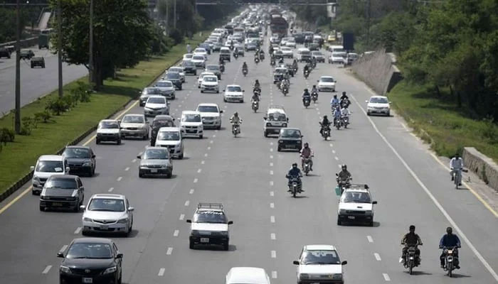 Commuters make their way along a motorway as they enter the capital city Islamabad. — AFP/ File