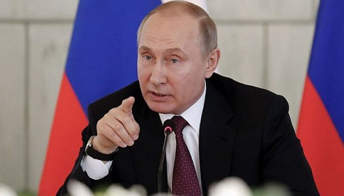 Russian President Vladimir Putin meets with medical staff while visiting the Almazov National Medical Research Centre in Saint Petersburg on March 16, 2018. — AFP/File