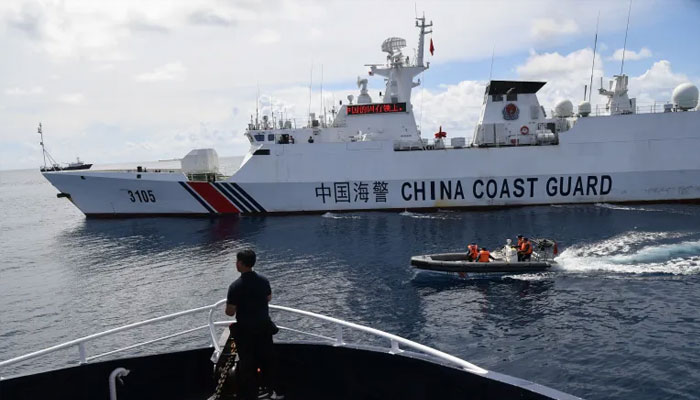 Chinese coastguard ship blocks a Philippine Bureau of Fisheries and Aquatic Resources ship as it neared the Chinese-controlled Scarborough Shoal in the disputed South China Sea. — AFP/File