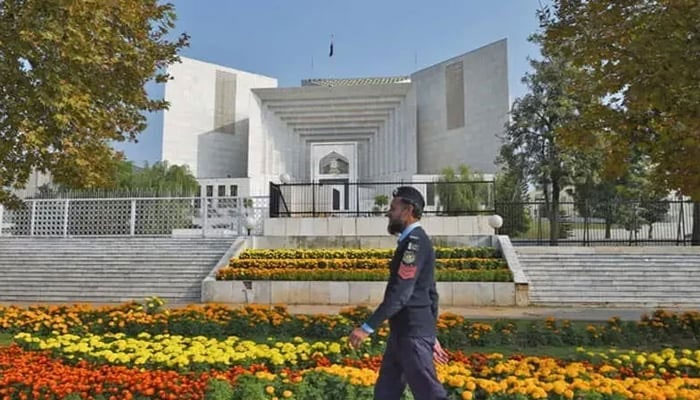 A policeman walks past the Supreme Court building in Islamabad, Pakistan. — AFP/File