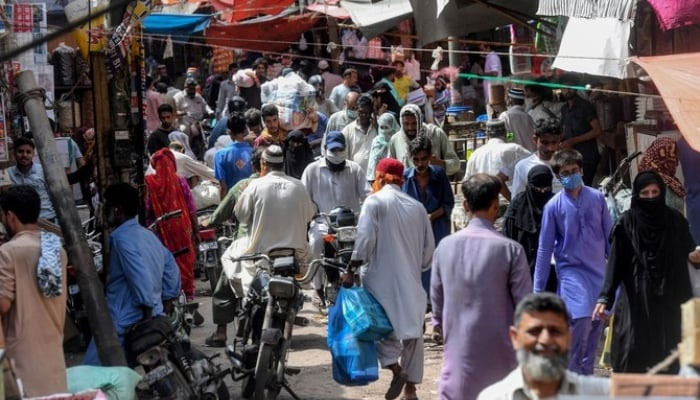 A representational image showing residents shop at a wholesale market in Karachi. — AFP/File