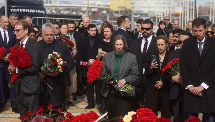 US Ambassador to Russia Lynne Tracy (C) attends a flower laying ceremony along with other dignitaries at the memorial in memory of the victims of the terrorist attack at the Crocus City Hall. — AFP/File
