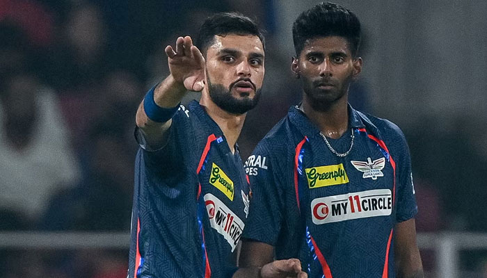 This image shows cricketers Mayank Yadav (R) and Naveen Ul Haq. — AFP/File