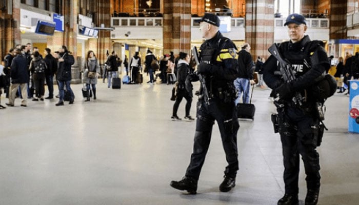 Dutch police patrolling Amsterdam central station. — AFP/File