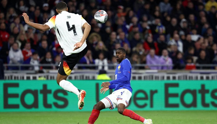 Players can be seen playing football.. — AFP/File