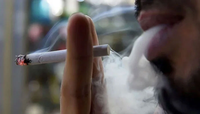 This representational image shows a man smoking. — AFP/File