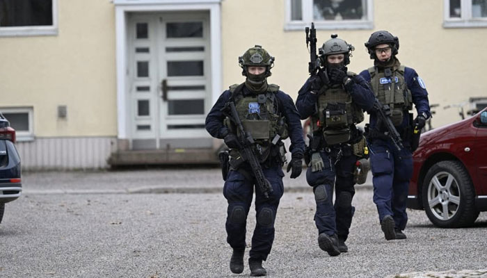 Police officials can be seen in this image. — AFP/File