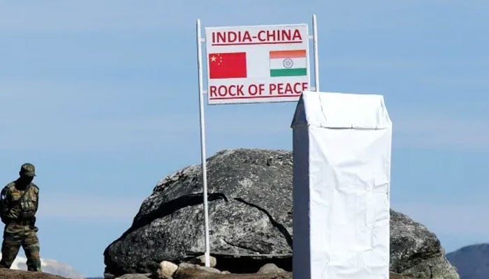 An Indian soldiers walk past near the India-China border. — AFP/File