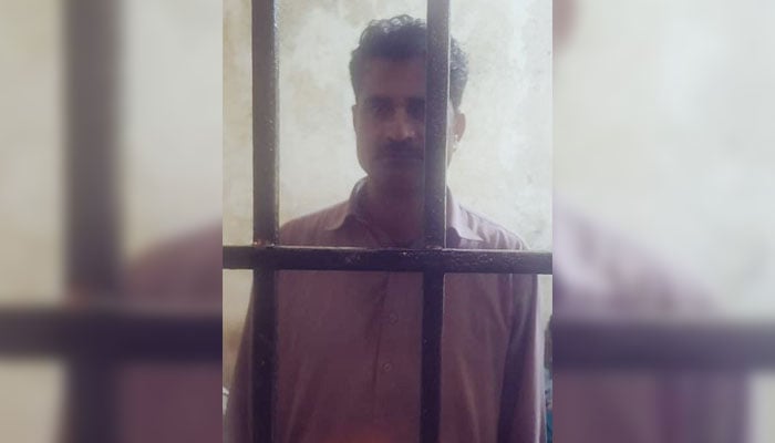 Constable Shahid whos video went viral for allegedly being intoxicated is seen locked up behind bars in the image released on April 3, 2024. — X/@Lahorepoliceops