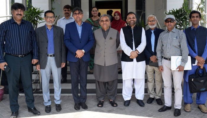 DG Youth Affairs Punjab Pervez Iqbal (C) and a delegation of Punjab Archives and Libraries Department take a group photo at National Hockey Stadium on April 3, 2024. — Facebook/ Directorate General Sports & Youth Affairs, Punjab