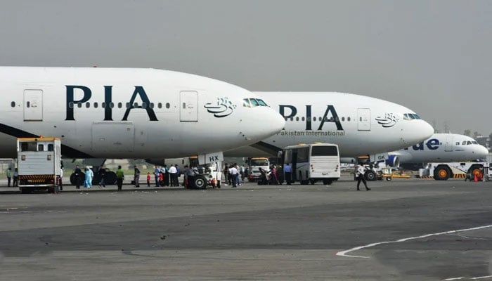 Pakistan International Airlines (PIA) passenger planes can be seen parked in this image. — X/@AFP/File