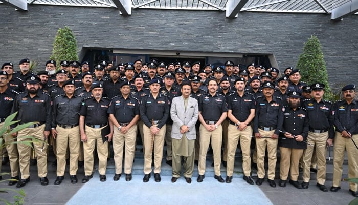 Sindh Home Minister Ziaul Hassan Lanjar and  IG Sindh Ghulam Nabi Memon possess for group photo with police officials an event  at Central Police Office on April 3, 2024. — Facebook/Sindh Police