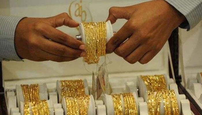 A representational image of gold bangles. —AFP/File