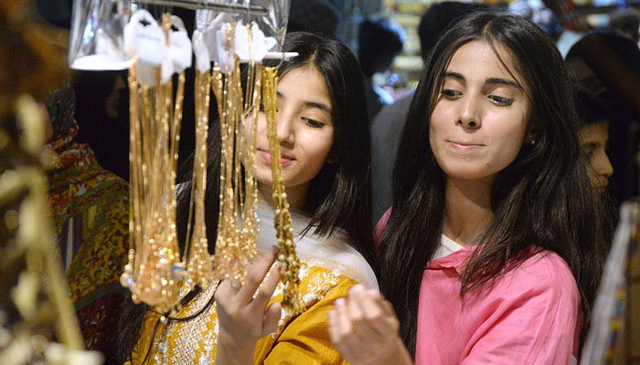 Girls purchase jewellery in preparation for the upcoming Eid-ul-Fitar on April 4, 2024. — APP