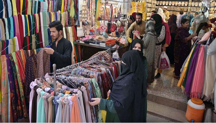 Women are busy Eid shopping at the Commercial market ahead of Eidul–Fitr on April 4, 2024. — APP
