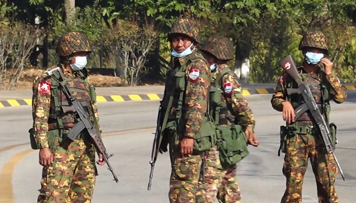Myanmars military personnel guarding a street. — AFP/File