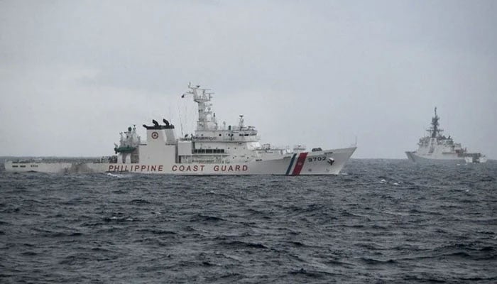 Philippine coast guard ship Melchora Aquino (eft) and US Coast Guard cutter Midgett maneuver during an exercise in the vicinity of the South China Sea. — AFP/File