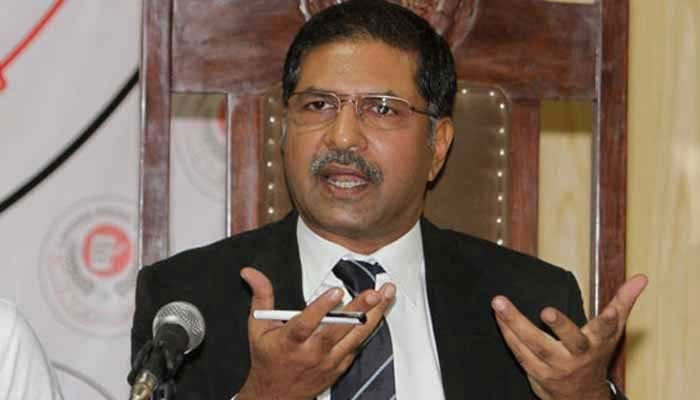 PTI Senator Syed Ali Zafar gestures as he speaks to the media at an event. — APP/File