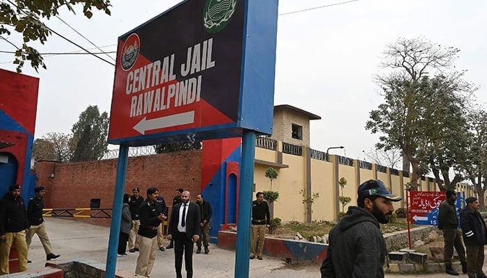 Police personnel stand outside the entrance of Adiala jail in Rawalpindi on January 30, 2024. — AFP