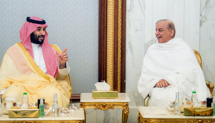 Saudi Arabias Crown Prince Mohammed bin Salman (left) meets PM Shehbaz Sharif at Al-Safa Palace in Makkah on April 7, 2024. — X/@Saudi_Gazette