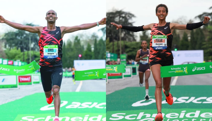 Mulugeta Uma (L), and Mestawut Fikir crossing the finish line. — AFP/File