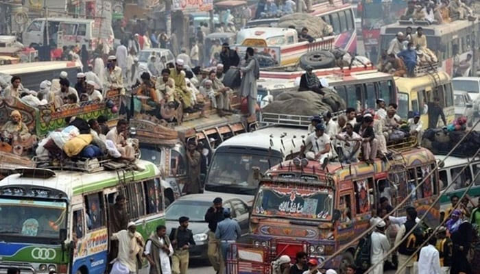 A representational image showing commuters travelling via public buses. — AFP/File