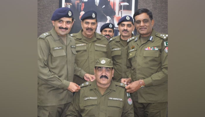 In this image, senior police officers pin promotion rank on ASI to a sub-inspector on April 7, 2024. — Facebook/Punjab Police Pakistan