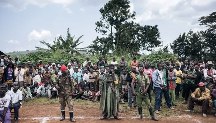 CODECO militiamen and members of the Lendu community attend a meeting with former strongmen in Wadda, Ituri province, northeastern DDRC on September 19, 2020. — AFP