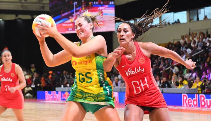 Australias Sophie Garbin evades Englands Geva Mentor during the Netball World Cup final. — AFP/File