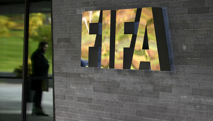 In this photo, taken on October 13, 2016, a sign of the FIFA is seen at the entrance of the world footballs governing body headquarters in Zurich. — AFP