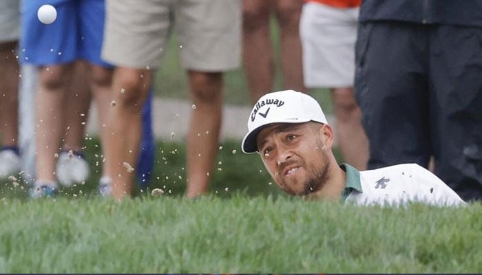 Mar 22, 2024; Palm Harbor, Florida, USA; Xander Schauffele hits from the bunker on the fifth green during the second round of the Valspar Championship golf tournament. Mandatory Credit: Reinhold Matay. — USA TODAY