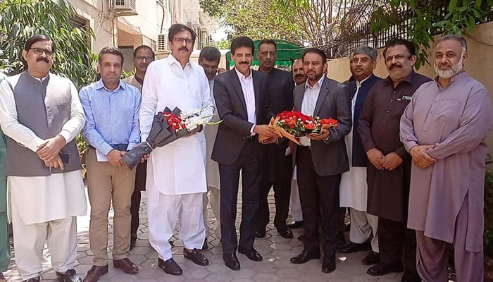Excise officials present flower bouquets to Director General Excise, Taxation, and Narcotics Control Punjab, Faisal Fareed during his visit to Excise Directorate Region B Lahore on April 9, 2024. — Facebook/Excise, Taxation & Narcotics Control Punjab, Pakistan