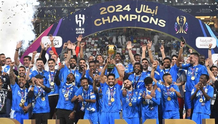 Al Hilal players celebrate with the trophy after winning the Saudi Super Cup final against Al Ittihad at Mohammed Bin Zayed Stadium in Abu Dhabi. — AFP/File