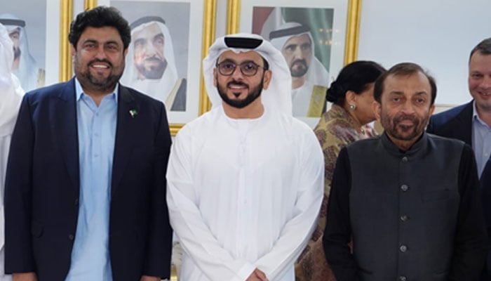 United Arab Emirates Consul General in Karachi Bakheet Ateeq Al-Remeithi (C) poses for a group photo along with Sindh Governor Kamran Tessori (L) and senior leader of the MQM-Pakistan Dr Farooq Sattar (R) at Eid Milan Party on April 11, 2024. — Facebook/Dr Farooq Sattar