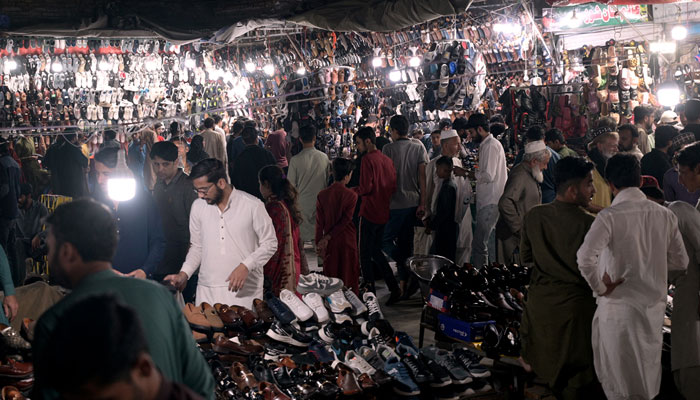 A large number of people are busy in shopping for the Eid-ul-Fitr festival at Raja Bazaar on April 9, 2024. — APP