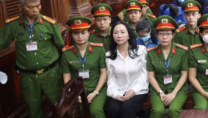 Vietnamese property tycoon Truong My Lan (front row 3nd L) looks on at a court in Ho Chi Minh City on April 11, 2024. — AFP/File