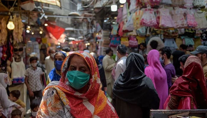 A representational image showing people at a local market in Rawalpindi. — AFP/File