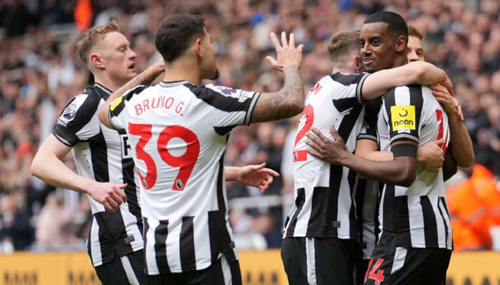 Newcastle United F.C. players celebrate during the match. — AFP/File