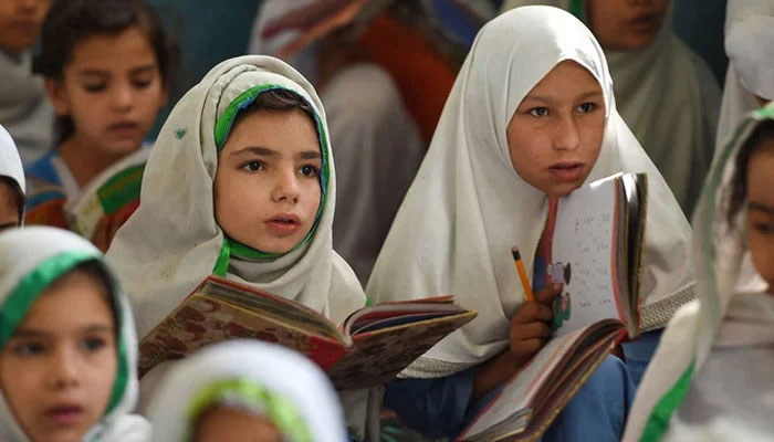 This picture shows girls attending a class in Mingora, a town in Swat Valley. — AFP/File