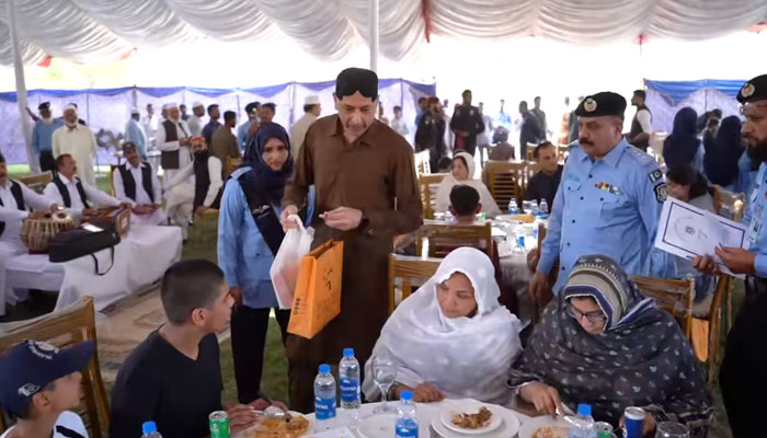 In this screengrab, Deputy Inspector General (DIG) Headquarters Hasan Raza Khan along with senior police officers distribute the gifts among the martyrs’ families on April 10, 2024. — Facebook/Islamabad Police