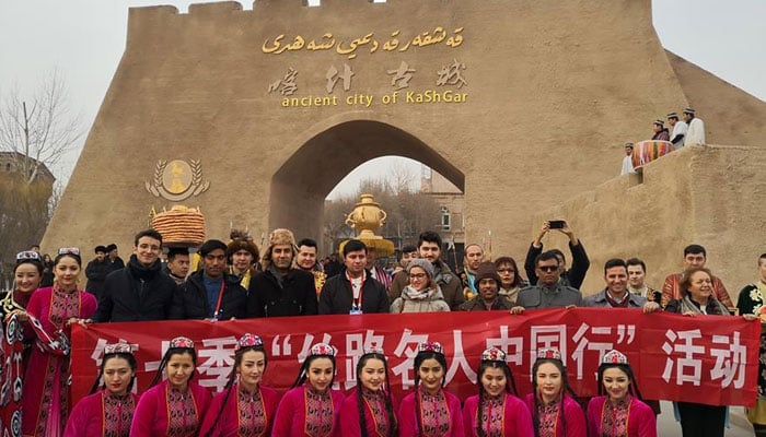 Media representatives of the Silk Road Celebrity China Tour attend a ceremony to enter the ancient city of Kashgar, northwest Chinas Xinjiang Uygur Autonomous Region. — Xinhua/File
