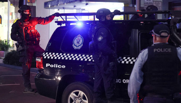 Police patrol in front of the Westfield Bondi Junction shopping mall after a stabbing incident in Sydney on April 13, 2024. — AFP