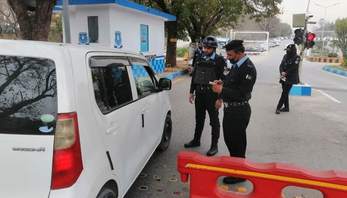 Police officials checking vehicles at a checkpoint in Islamabad on March 11, 2024. — Facebook/Islamabad Police