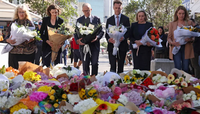 Australian Prime Minister Anthony Albanese (centre) with New South Wales Premier Chris Minns outside the Westfield Bondi Junction shopping mall in Sydney on April 14, 2024. — AFP