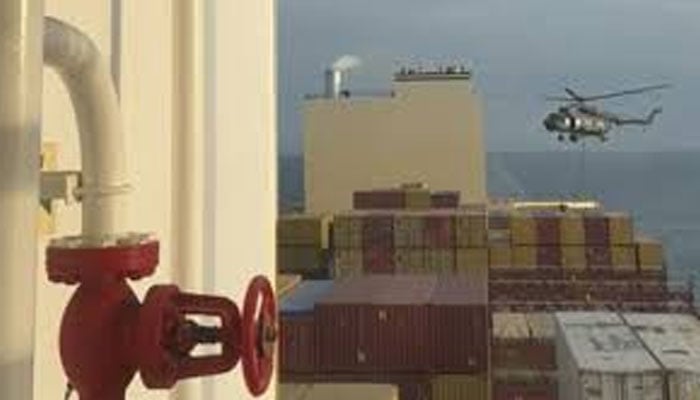 This image grab taken from a video shows an IRGC helicopter hovering over a container ship named MSC Aries. — Geo News Live/File