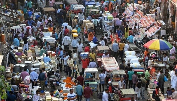 A representational image showing people walking in a market in India. — AFP/File