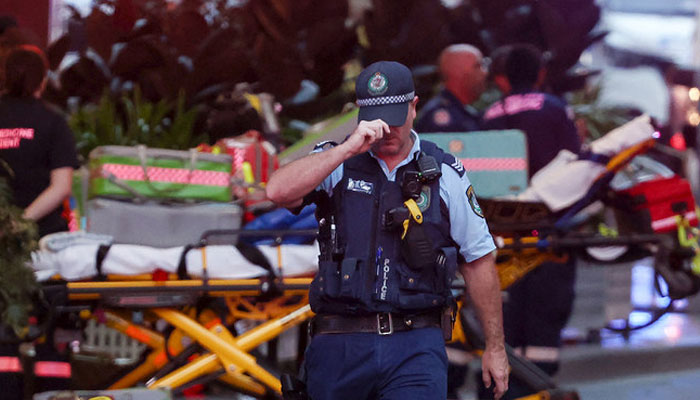 A police officer reacts outside the Westfield Bondi Junction shopping mall after a stabbing incident in Sydney on April 13, 2024. — AFP