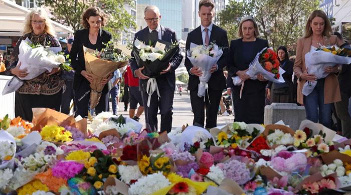 Tributes flow for six victims killed in Australia mall stabbing