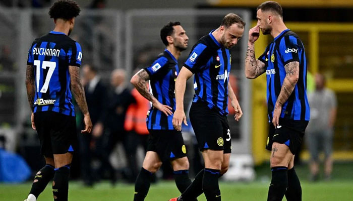 Inter Milans players react at the end of the Italian Serie A football match between Inter Milan and Cagliari. — AFP/File