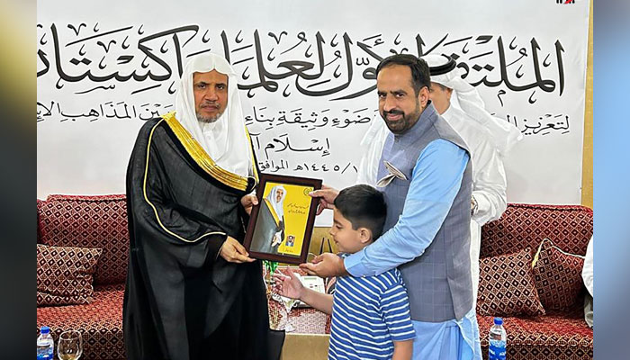 Prof Sajjad Qamar presents the title of his book to the Secretary General of the Muslim World League, Shiekh Dr Muhammad Bin Abdulkarim Al-Issa during a ceremony on April 15, 2024. — INP